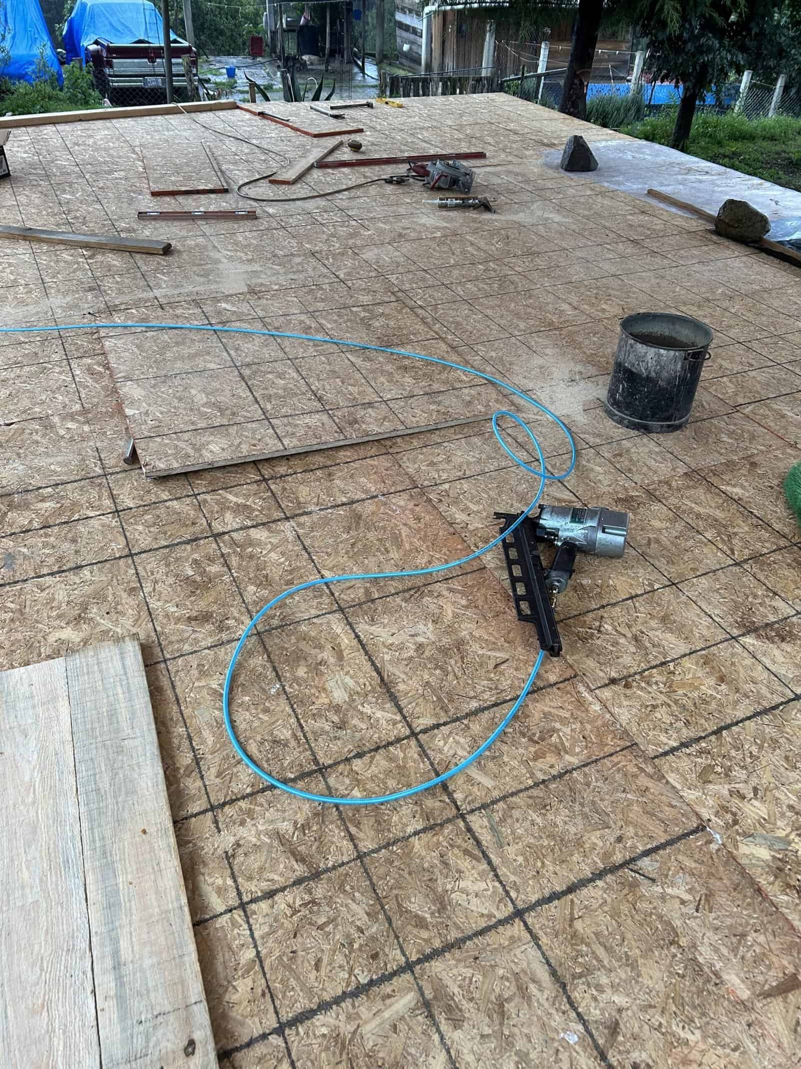Construction site with tools and materials for building foundation.